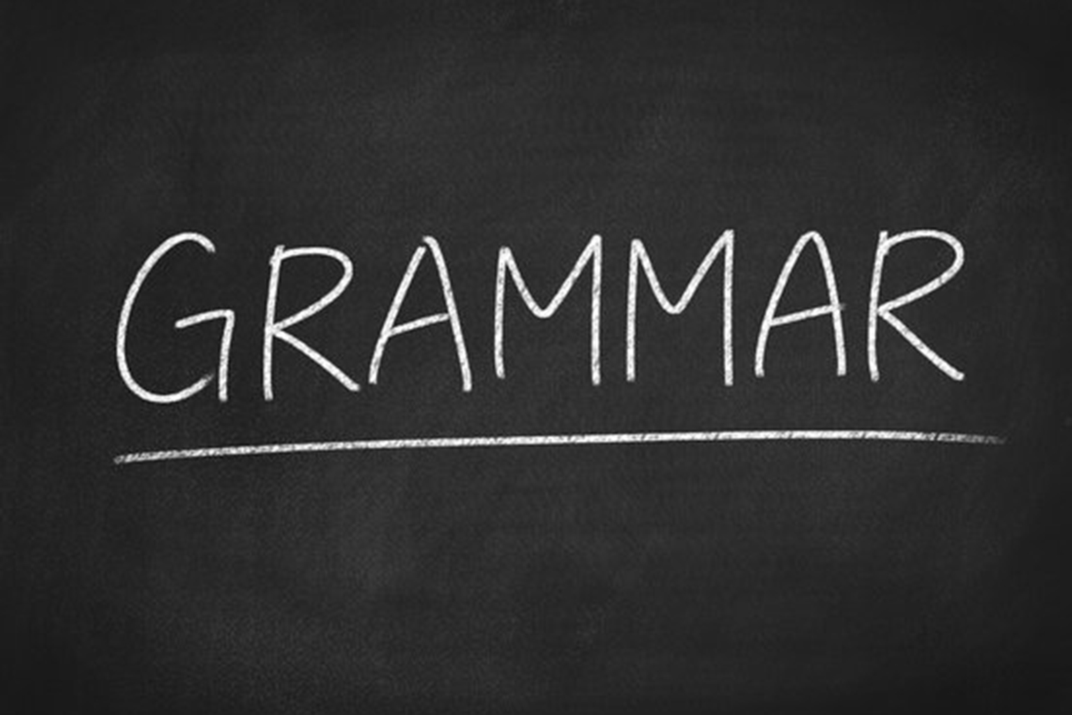 a blackboard with the word grammar written on it.